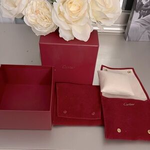 Cartier velvet pouches for jewelry x2, one ring pillow, one jewelry box.